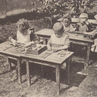 Scene in the garden of a Children's House, Berlin-Lankwitz, 1919-22. Postcard published by the DMG (German Montessori Society), around 1927 - T. Müller, R. Schneider, <em>Lehrmaterialien 1913-1935. Möbel und Architektur. Techning Meterials 1913-1935. Furniture and Architecture</em>, München, Prestel Verlag, 2002, p.33.$$$373
