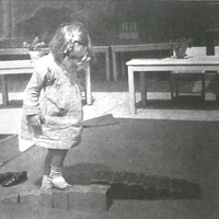 The little girl from the Children's House in Altona has placed the Tower on the floor and is feeling it with her feet. Maybe she will also climb onto the Broad Stair, which is also within her reach. Photo taken around 1928 - T. Müller, R. Schneider, <em>Lehrmaterialien 1913-1935. Möbel und Architektur. Techning Meterials 1913-1935. Furniture and Architecture</em>, München, Prestel Verlag, 2002, p.91$$$450