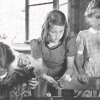 Third-year schoolgirls giving the flowers fresh water. Montessori class, Berlin-Tegel, 1950 - T. Müller, R. Schneider, <em>Lehrmaterialien 1913-1935. Möbel und Architektur. Techning Meterials 1913-1935. Furniture and Architecture</em>, München, Prestel Verlag, 2002, p.85$$$437