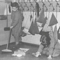 Housework is one of the exercises that children choose very eagerly. Here two children are polishing the floor. The necessary materials are kept in their place and put back again when the work has been completed. Montessori nursery, Berlin-Tempelhof, 1955 - T. Müller, R. Schneider, <em>Lehrmaterialien 1913-1935. Möbel und Architektur. Techning Meterials 1913-1935. Furniture and Architecture</em>, München, Prestel Verlag, 2002, p.80$$$420