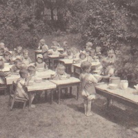 Lunch in the garden of one of the Berlin Children's Houses. Small "waiters" going about their work. Postcard published by the DMG (German Montessori Society), around 1927 with the inscription: "If, when creating an environment for the child, care is taken to make it suitable to his nature, he will from an early age prove to be a social being, willing to attend to the welfare of others." Photograph: Clara Grunwald - T. Müller, R. Schneider, <em>Lehrmaterialien 1913-1935. Möbel und Architektur. Techning Meterials 1913-1935. Furniture and Architecture</em>, München, Prestel Verlag, 2002, p.82$$$428