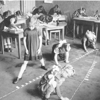 Eight-year-old girls are counting out the thousand-bead chain. One of them in turn takes a step from one hundred mark to the next: "A hundred is always than lenght", Berlin-Tegel, 1949 - T. Müller, R. Schneider,<em> Lehrmaterialien 1913-1935. Möbel und Architektur. Teaching Materials 1913-1935. Furniture and Architecture</em>, München, Prestel Verlag, 2002, p.110.$$$362